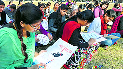 Students take part in a poster-making competition during an NSS camp at SCD Government College in Ludhiana on Thursday