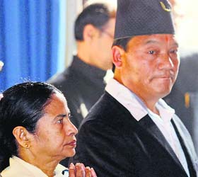 West Bengal CM Mamata Banerjee with GJM chief Bimal Gurung at Raj Bhavan in Kolkata on Thursday