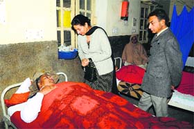 Union MoS for External Affairs Preneet Kaur speaks to an injured Congress worker at Governement Rajindra Hospital in Patiala on Thursday
