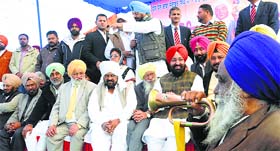PPCC president Partap Singh Bajwa (red turban) and other Congress leaders at a really at the Shaheedi Jor Mela in Fatehgarh Sahib on Thursday