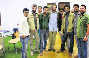 Atharv Baluja (centre) with his team