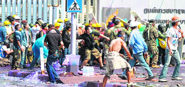 Anti-government protesters clash with the police during a rally in Bangkok on Thursday. 
