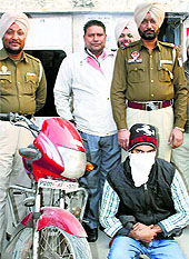 The Sadar police with the alleged drug peddler in Amritsar on Friday