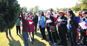 Delhi-based environmentalist Kavita Prakash tells residents about a tree during the nature walk at the Rose Garden in Chandigarh on Friday.