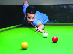 Aim to win: A player takes a shot during the Haryana Billiards and Snooker State Ranking Championship at Sector 11, Panchkula, on Friday.