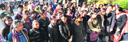 Computer teachers and data entry operators gather to hold a protest at Sector 9, Chandigarh, on Friday. 