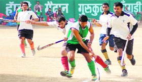 A hockey match in progress during the 82nd All-India Swami Shraddhanand Tournament in Haridwar on Friday.