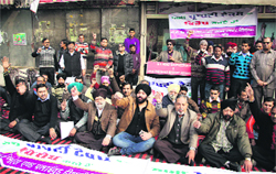 Mai Hiran Gate Book Market shopkeepers protest against property tax in Jalandhar on Friday.Photo: Sarabjit Singh