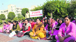 Technical and paramedical staff of Punjab Insitute of Medical Sciences hold a demonstration in Jalandhar on Friday. Tribune photo: Malkiat Singh