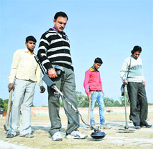 Security personnel conducting a check at the MA Stadium ground, the main venue for Republic Day celebrations, in Jammu. 