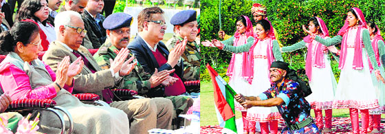 Governor NN Vohra and his wife Usha Vohra appreciate a cultural programme being presented by NCC cadets at Raj Bhawan in Jammu on Friday. 
