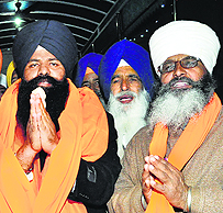 Lakhwinder Singh (left) and Shamsher Singh at Gurdwara Amb Sahib in Mohali on Friday.