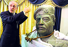 Mowaffak al-Rubaie, former national security adviser, with a statue of Saddam Hussein, recalls his final minutes in Baghdad
