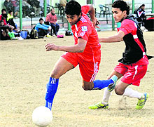 A match in progress during the Swami Vivekanand Memorial District-Level Football Tournament at Pavellion Ground in Dehradun on Saturday