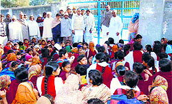 Students protest outside Government Senior Secondary School at Talu village in Bhiwani on Saturday