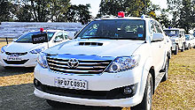 Official vehicles parked during Chief Minister Virbhadra Singh's arrival at Dharamsala on Saturday