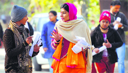 Candidates discuss questions after appearing for teachers’ eligibility test (TET) at the Punjab Agricultural University in Ludhiana on Saturday. Tribune Photo: Himanshu Mahajan P2