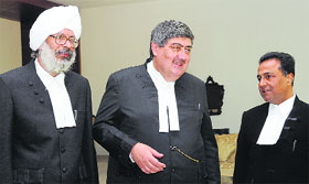 Justice Harinder Singh Sidhu (L), Chief Justice Sanjay Kishan Kaul and Justice Arun Palli (R) after the oath-taking ceremony at the Punjab and Haryana High Court in Chandigarh on Saturday.