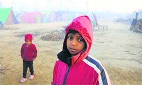 It is a challenge for 10-year-old Adil to keep himself warm at Malakpur relief camp, the largest in Shamli district, where 33 children have died of cold