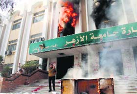 A building at Cairo's Al-Azhar University set ablaze by student supporters of the Muslim Brotherhood on Saturday