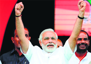 Battle cry: Gujarat Chief Minister and the Bharatiya Janata Partys prime-ministerial candidate Narendra Modi attracted huge crowds, as he dwelt on his development mantra. With an eye on the 2014 General Election, Modi remained in attack mode and minced no words while launching a frontal offensive against the Congress leadership