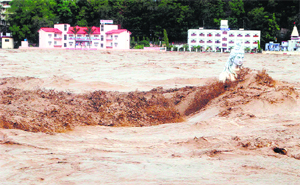 Wrath of the gods: A submerged statue of Lord Shiva stands amid the flood waters of the Ganga at Rishikesh in Uttarakhand