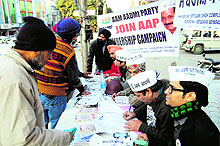Workers of the Aam Aadmi Party carry out a membership drive in Amritsar on Sunday