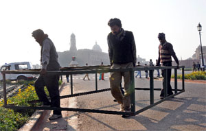 Men at work for the Republic Day Parade and the Beating Retreat Ceremomy at Vijay Chowk in New Delhi on Sunday.