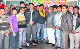 BJP state vice-president Madan Kaushik welcomes the new party members in Haridwar on Sunday