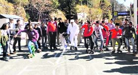 Senior citzens participate in a roller skating race in Mussoorie on Sunday
