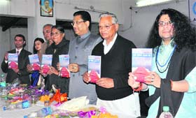 Uttarakhand Assembly Speaker Govind Singh Kunjwal (second from right) releases a poetry book at a function in Dehradun on Sunday
