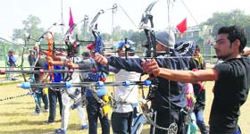 Participants during the state-level archery competition at Gurgaon on Sunday