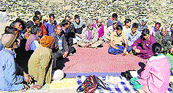 Villagers of adjoining areas discuss the imminent danger arising out of the Chanju hydroelectric project