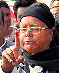 RJD chief Lalu Prasad Yadav talks to riot-affected people at a relief camp in Muzaffarnagar on Sunday