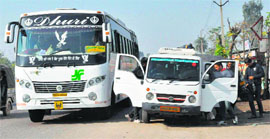 Passengers being shifted to Maxicabs on the Kharar-Mohali highway.