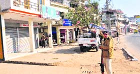 A policeman stands guard as the Khuda Lahora market wears a deserted look during Prime Minister Manmohan Singhs visit to Mullanpur on Monday