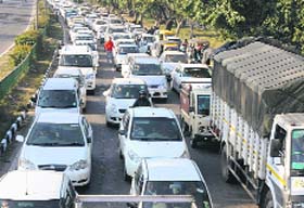Motorists caught in a traffic jam on the road leading from the GMCH-32 to Tribune Chowk