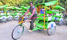 A rickshaw-puller in a jubilant mood at the ISBT, Sector 43, in Chandigarh on Monday
