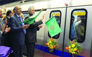 Union Development Secretary and DMRC Chairman Sudhir Krishna and Delhi Metro Managing Director Mangu Singh (L) flagging off the trial run of the first section of the Phase III route between Central Secretariat and Mandi House stations in New Delhi on Monday. 