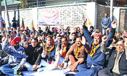 BJP leaders stage a dharna in front of the Secretariat in Dehradun on Monday. A Tribune photograph