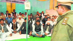 SP Shasank Anand talks to sarpanches of Gharounda block in Karnal on Monday. A tribune photograph