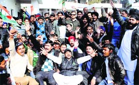 Members of Jammu and Kashmir Pradesh Youth Congress protest in front of the Deputy Commissioners Office in Jammu on Monday