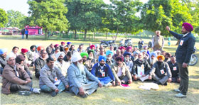 Employees participate in a rally on the PAU campus in Ludhiana.