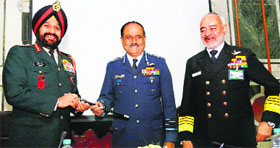 Air Chief Marshal NAK Browne (centre) handing over the baton of the Chairman, Chiefs of Staff Committee, to General Bikram Singh as Chief of Naval Staff Admiral DK Joshi (right) looks on.
