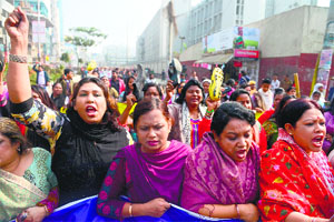 Bangladesh Awami League supporters march during a procession in Dhaka on Monday.