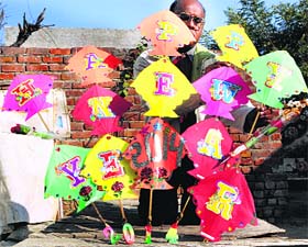 On the threshold: Kite maker Jagmohan Kanojia works on New Year greeting kites at his home