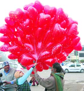 Time to celebrate: A boy buys balloons on the New Year eve in Amritsar on Tuesday