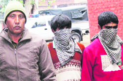 The accused in police custody at the Sector 26 police station in Chandigarh on Tuesday. Tribune Photo: Manoj Mahajan