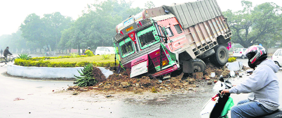 The truck that rammed into the Sector 11, 10, 2 and 3 roundabout in Chandigarh on Tuesday. Tribune Photo: Pradeep Tewari