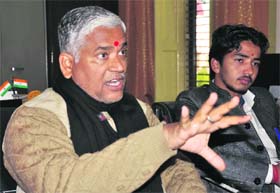 Dr Bhola Jha, Principal of Bhagwan Das Adarsh Sanskrit Maha Vidyalaya, and Pankaj Upreti, students union representative, inform about the state-level Sanskrit competition in Haridwar on Tuesday
